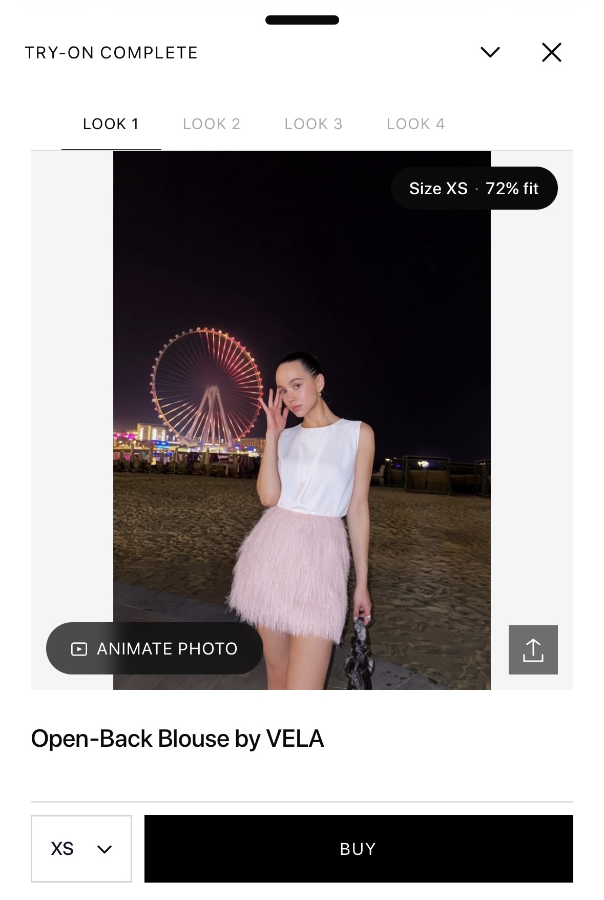 Virtual try-on result with an AI size recommendation Looksy AI virtual try-on result showing a white blouse with an XS size recommendation